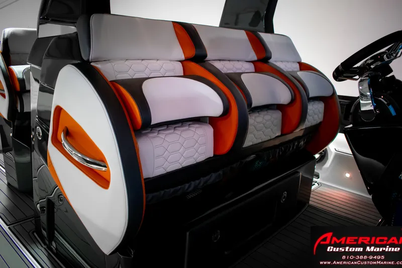 Slide: The Image of 2027 Nor-Tech 450 Sport Center Console interior with modern, stylish seating design. - 18