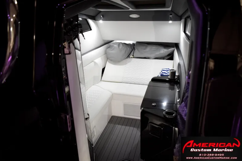 Slide: The Image of Luxurious cabin interior of 2027 Nor-Tech 450 Sport Center Console boat. - 19