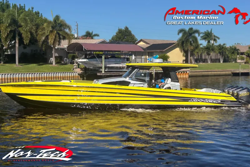 Slide: The Image of 2027 Nor-Tech 450 Sport Center Console boat on water, vibrant yellow design, American Custom Marine. - 5