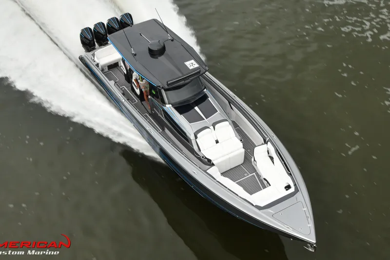 Slide: The Image of 2027 Nor-Tech 450 Sport Center Console speeding on water, showcasing sleek design and powerful engines. - 8