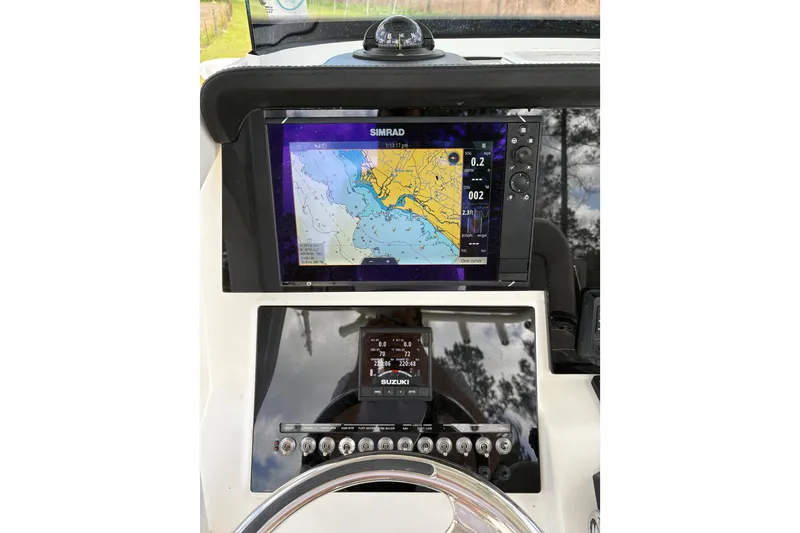 Slide: The Image of Dashboard of 2021 Sea Pro 259 DLX boat with navigation system. - 11