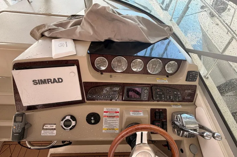 Slide: The Image of Control panel of a 2010 Sea Ray 370 Express Cruiser with Simrad navigation system. - 10