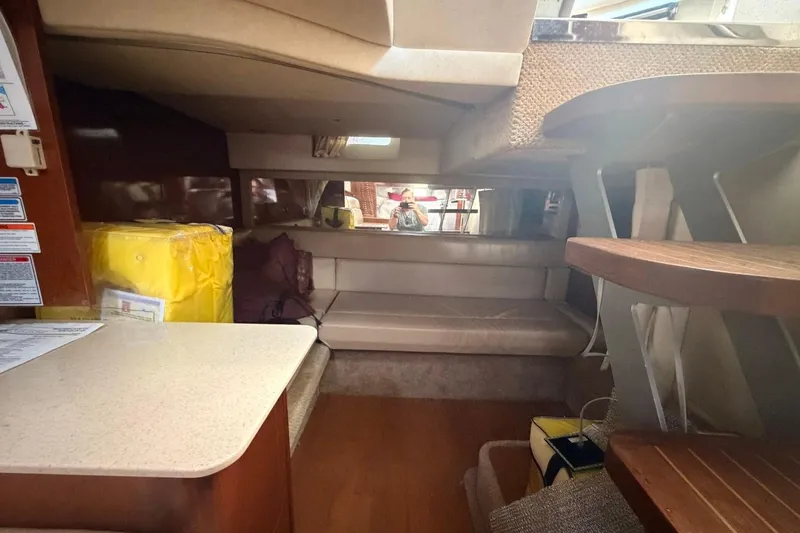 Slide: The Image of Interior of 2010 Sea Ray 370 Express Cruiser with seating and storage areas. - 13