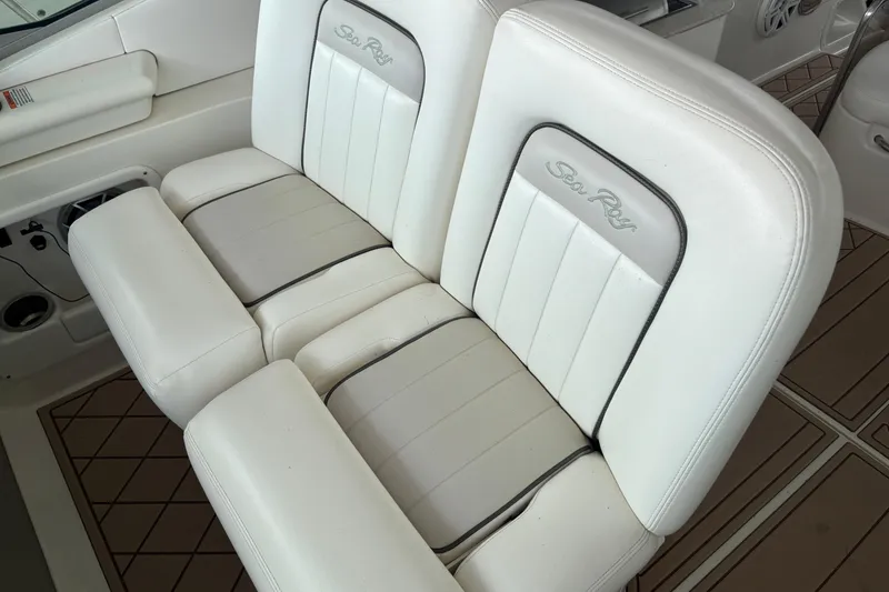 Slide: The Image of White leather seating on a 2010 Sea Ray Sundancer 370 boat, featuring elegant design. - 19