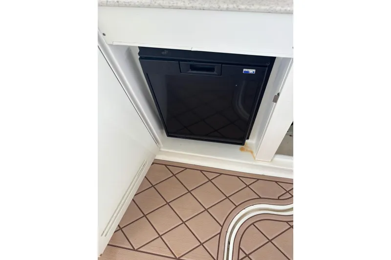 Slide: The Image of Compact refrigerator in 2010 Sea Ray Sundancer 370 yacht interior. - 23