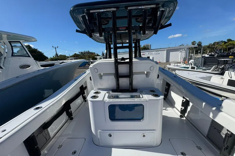 Slide: The Image of 2026 Tidewater 302 CC Adventure boat interior with modern console and seating. - 11