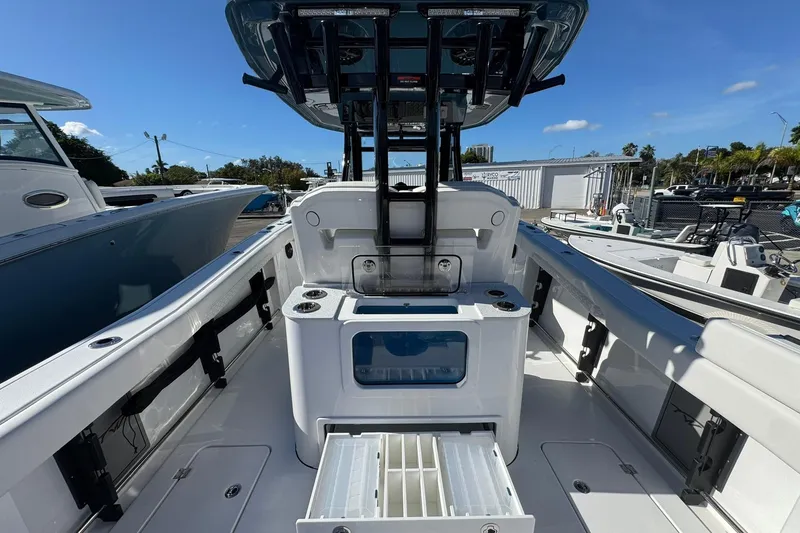 Slide: The Image of 2026 Tidewater 302 CC Adventure boat interior with fishing amenities and storage compartments. - 12