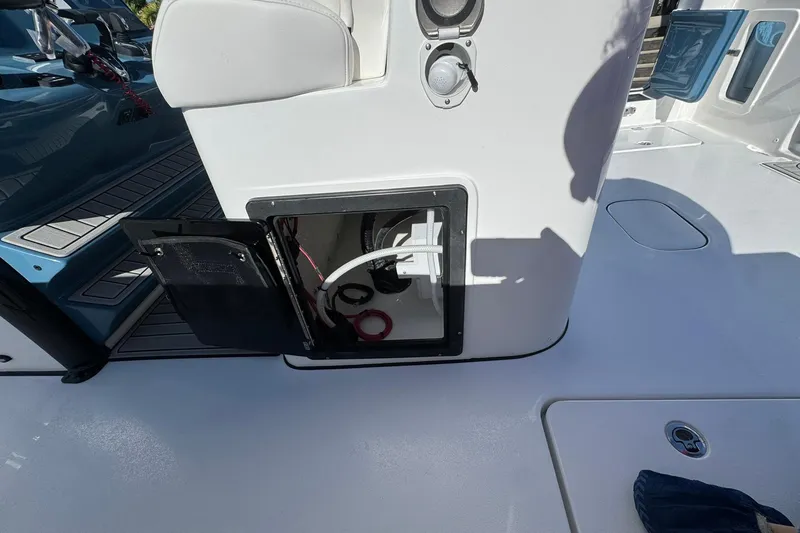 Slide: The Image of Open storage compartment on 2026 Tidewater 302 CC Adventure boat deck. - 15