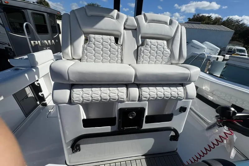 Slide: The Image of Luxurious seating on 2026 Tidewater 302 CC Adventure boat, featuring quilted upholstery. - 19