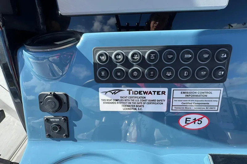 Slide: The Image of Control panel of 2026 Tidewater 302 CC Adventure boat with certification and emission information. - 23