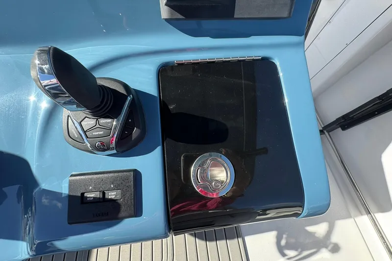 Slide: The Image of Control panel of 2026 Tidewater 302 CC Adventure boat with joystick and start-stop buttons. - 25