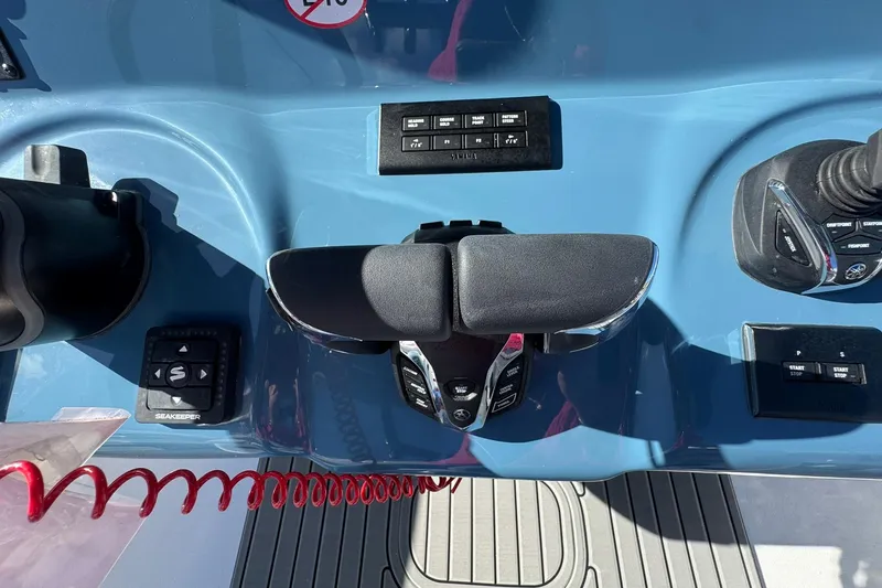 Slide: The Image of Control panel of 2026 Tidewater 302 CC Adventure boat with joystick and buttons. - 26