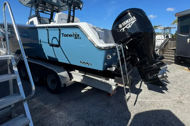 Slide: The Image of 2026 Tidewater 302 CC Adventure boat with Yamaha engine on trailer. - 3