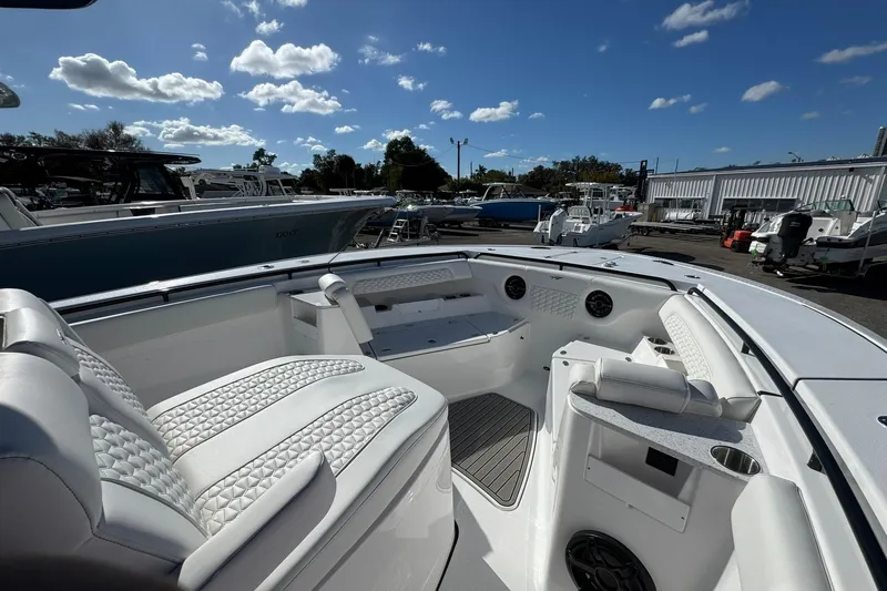 Slide: The Image of 2026 Tidewater 302 CC Adventure boat interior with luxurious seating and modern design. - 39