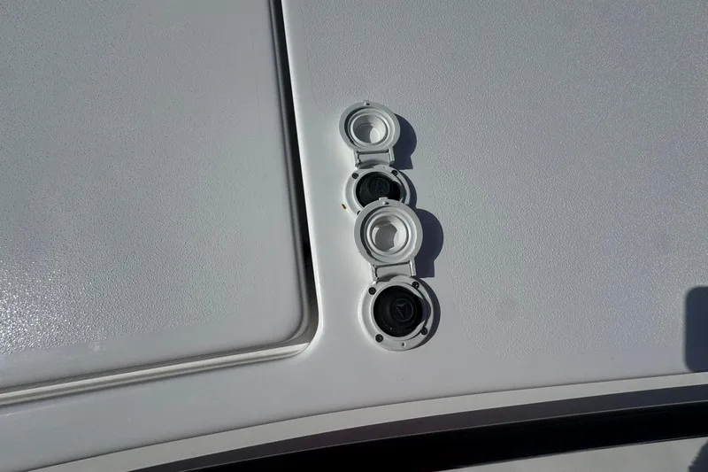 Slide: The Image of 2026 Tidewater 302 CC Adventure boat deck with closed hatches and fittings. - 49