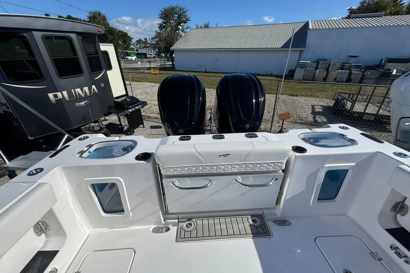 Slide: The Image of 2026 Tidewater 302 CC Adventure boat with dual engines and spacious deck layout. - 5