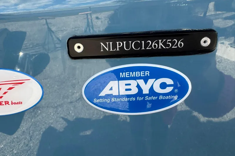 Slide: The Image of Tidewater 302 CC Adventure 2026 boat with ABYC membership sticker and serial number. - 50