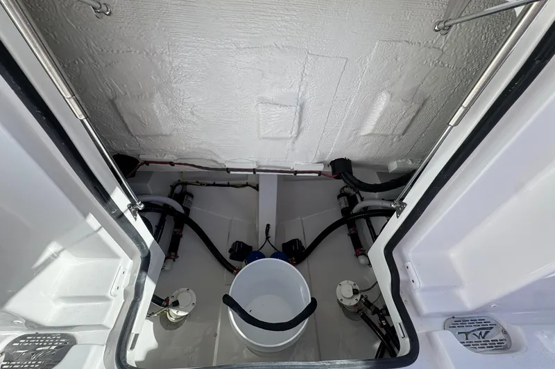 Slide: The Image of Interior view of 2026 Tidewater 302 CC Adventure boat's storage compartment. - 7