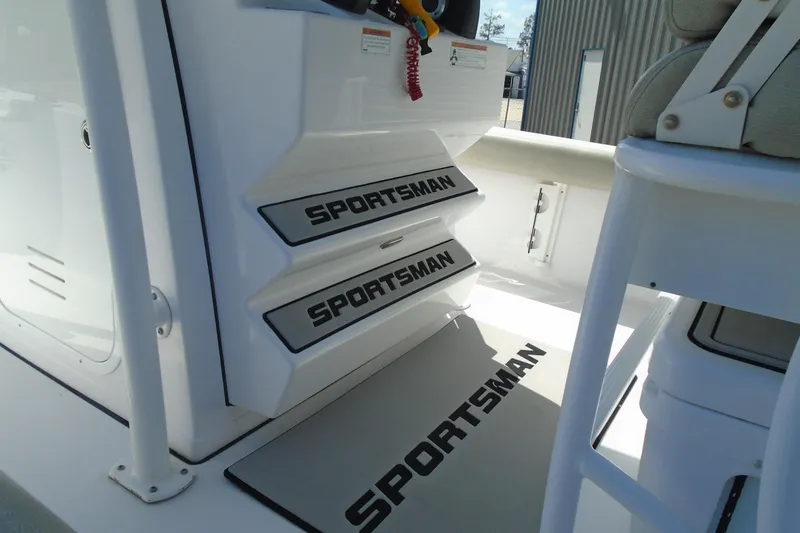 Slide: The Image of 2021 Sportsman Masters 247 Bay Boat interior with branded steps and seating. - 10