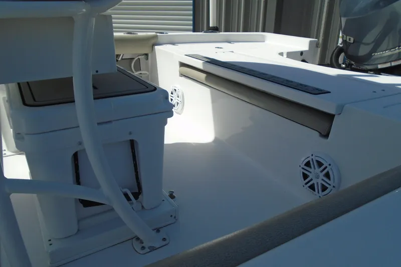 Slide: The Image of 2021 Sportsman Masters 247 Bay Boat interior with seating and storage features. - 12