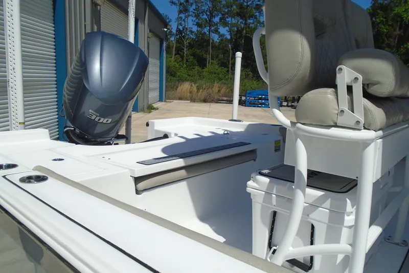 Slide: The Image of 2021 Sportsman Masters 247 Bay Boat with Yamaha 300 engine, docked outdoors. - 4