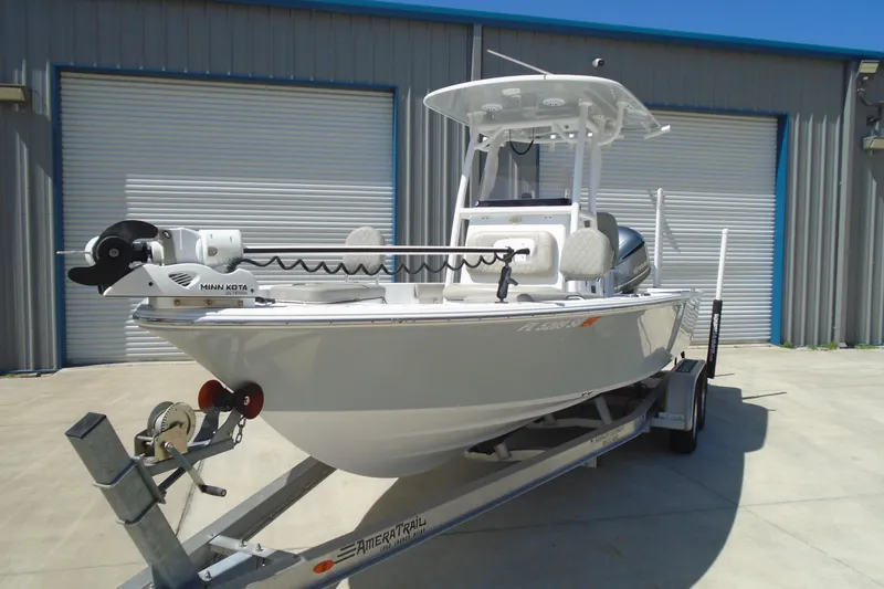 Slide: The Image of 2021 Sportsman Masters 247 Bay Boat on trailer, featuring Minn Kota trolling motor. - 7