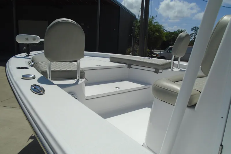 Slide: The Image of 2021 Sportsman Masters 247 Bay Boat interior with seating and storage compartments. - 9