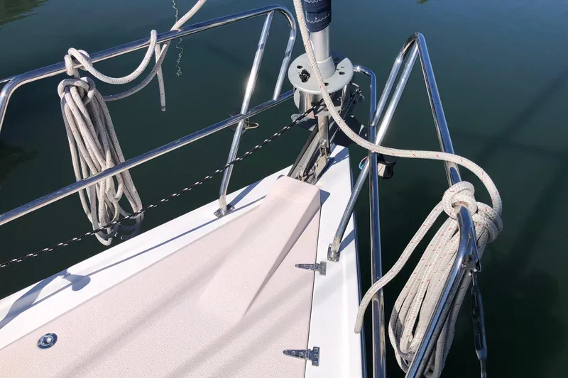 Slide: The Image of Deck of a 1998 Catalina 380 sailboat with coiled ropes and stainless steel railings. - 11