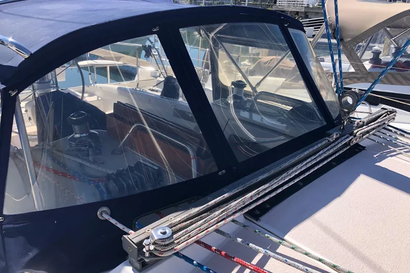 Slide: The Image of 1998 Catalina 380 sailboat cockpit with protective canopy and visible rigging. - 15