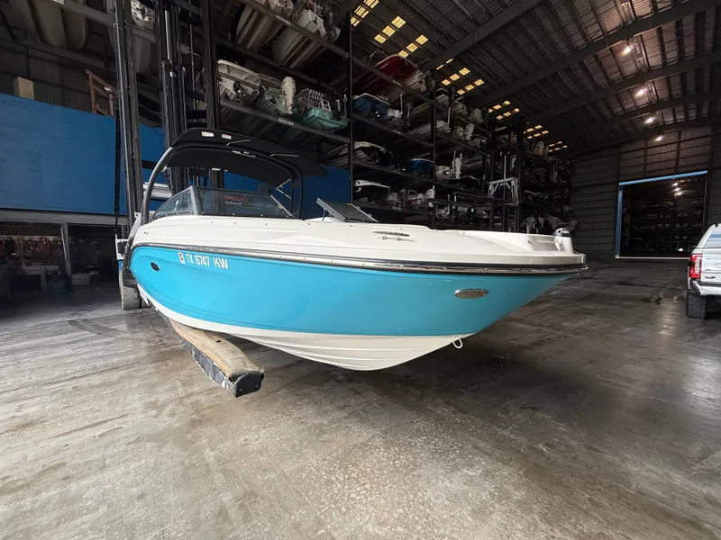 Slide: The Image of 2023 Sea Ray 23 SPX OB boat in storage facility. - 1