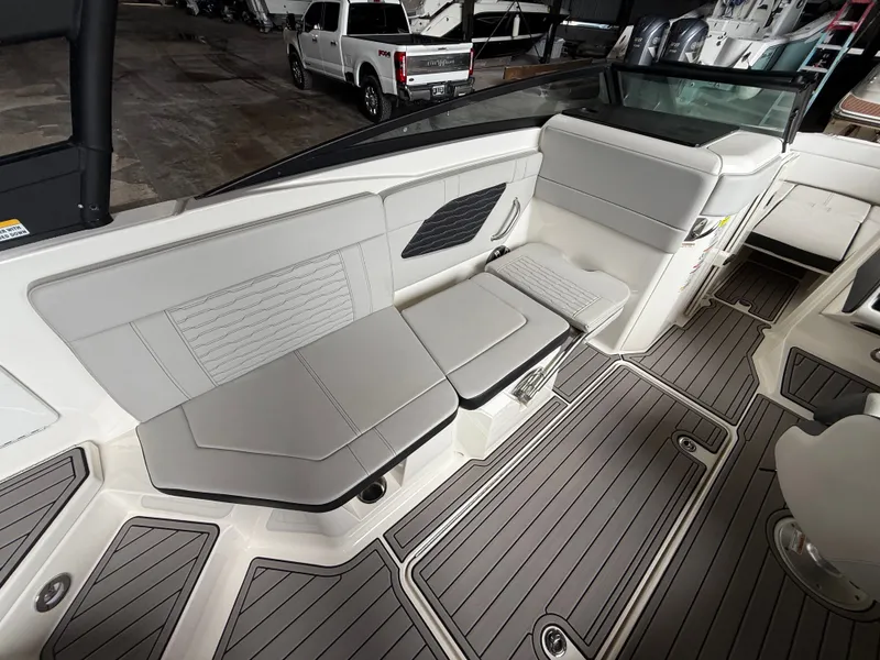 Slide: The Image of Interior of a 2023 Sea Ray 23 SPX OB boat with gray seating. - 11