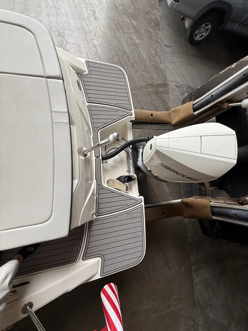 Slide: The Image of Rear view of a 2023 Sea Ray 23 SPX OB boat with outboard motor. - 19