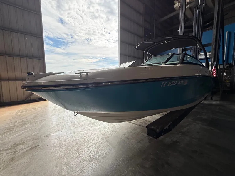 Slide: The Image of 2023 Sea Ray 23 SPX OB boat in warehouse. - 2