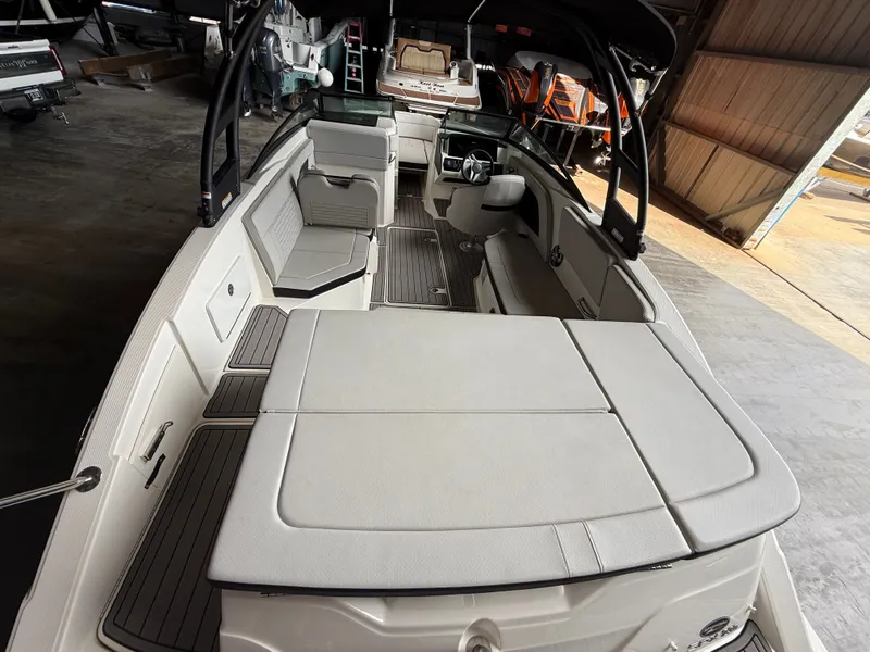 Slide: The Image of Interior view of a 2023 Sea Ray 23 SPX OB boat in a warehouse. - 20