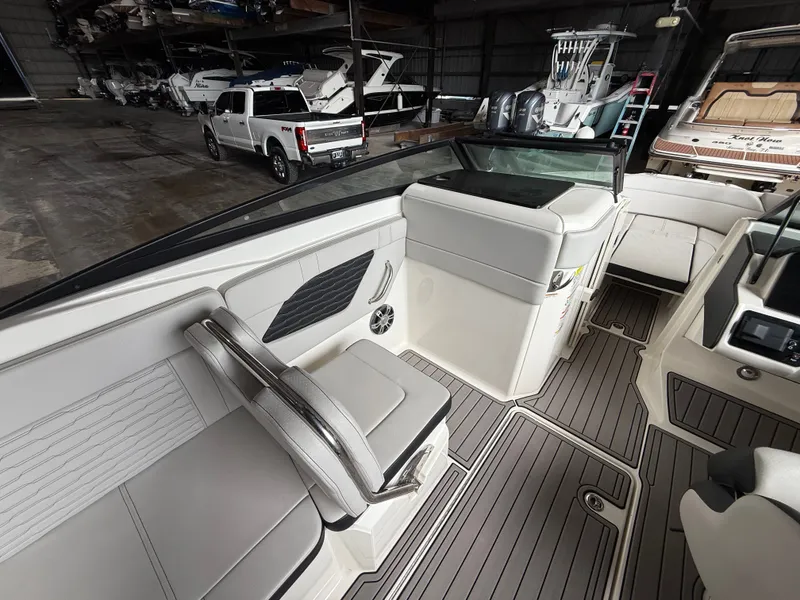 Slide: The Image of Interior of a 2023 Sea Ray 23 SPX OB boat in a storage facility. - 7
