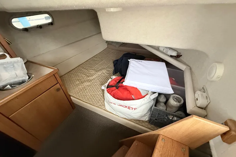 Slide: The Image of Interior cabin of 2000 Bayliner 3388 Command Bridge Motoryacht with storage items. - 9