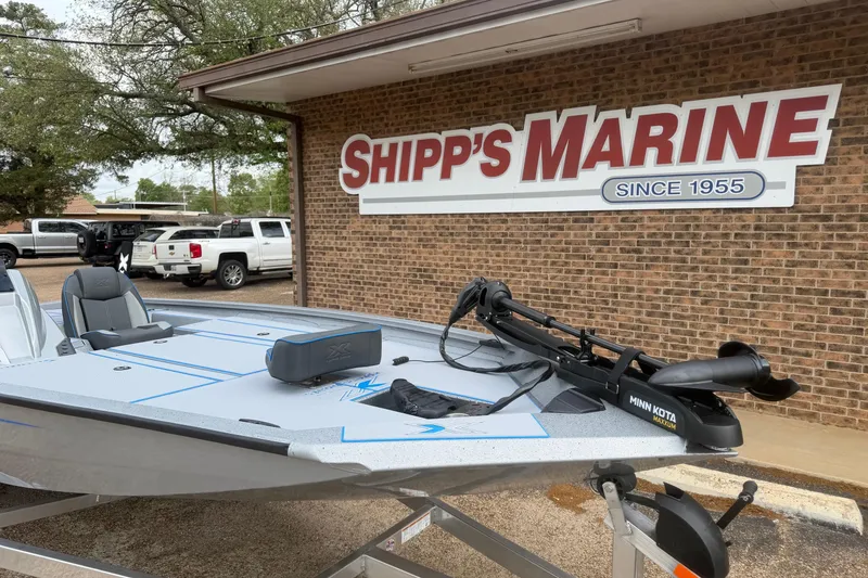 Slide: The Image of 2026 Xpress H20 boat at Shipp's Marine dealership, featuring Minn Kota trolling motor. - 4