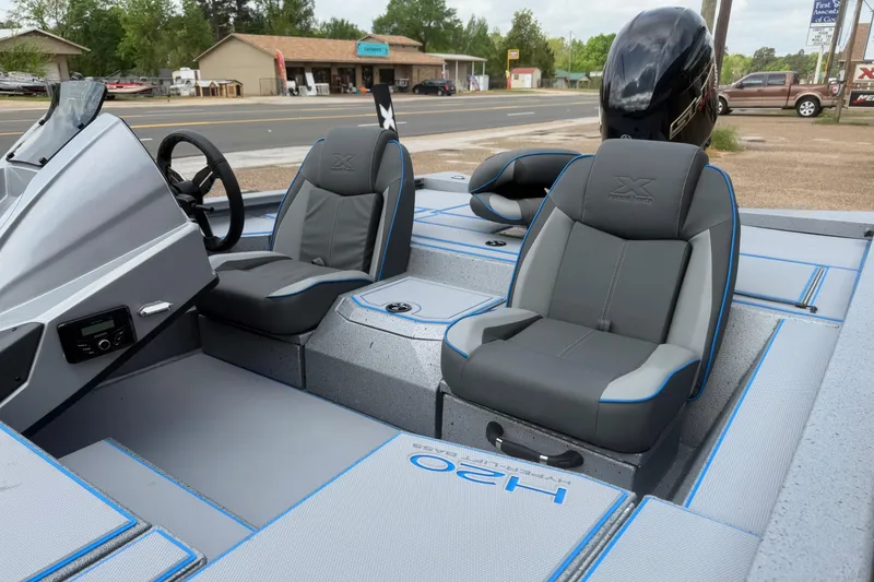 Slide: The Image of 2026 Xpress H20 boat interior with sleek gray seating and modern dashboard design. - 5