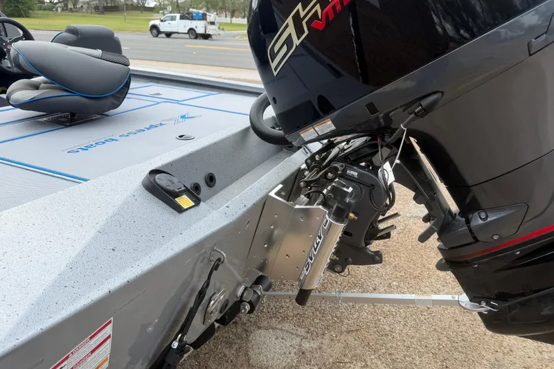 Slide: The Image of 2026 Xpress H20 boat with powerful outboard motor and sleek seating design. - 7