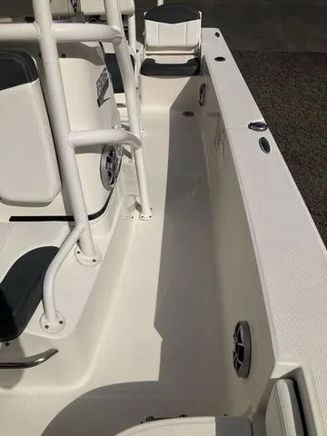 Slide: The Image of Interior of a 2020 Robalo 206 Cayman boat, white seating and handrails. - 17