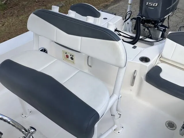 Slide: The Image of Interior view of a 2020 Robalo 206 Cayman boat with seating area. - 21