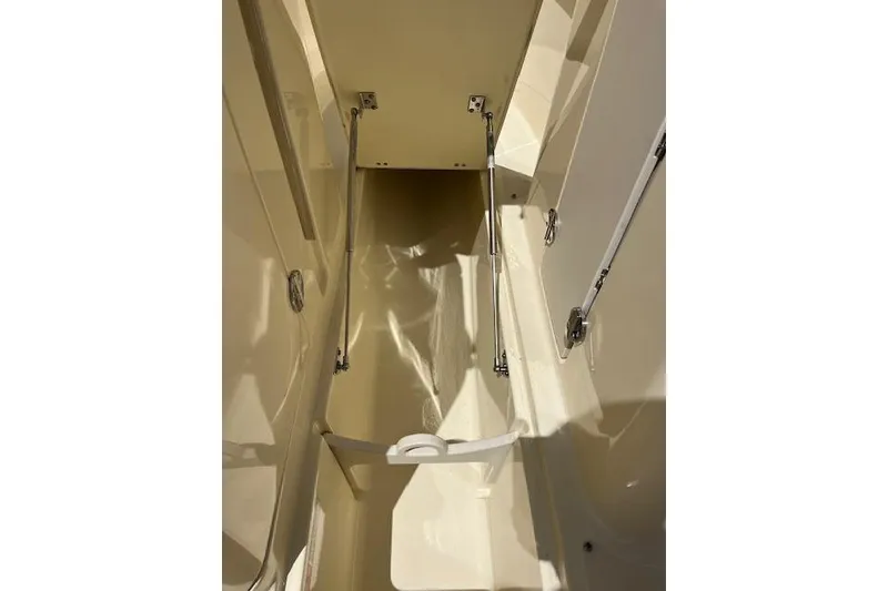 Slide: The Image of 2019 Chris-Craft Launch 27 boat interior with elegant dashboard and steering wheel. - 14