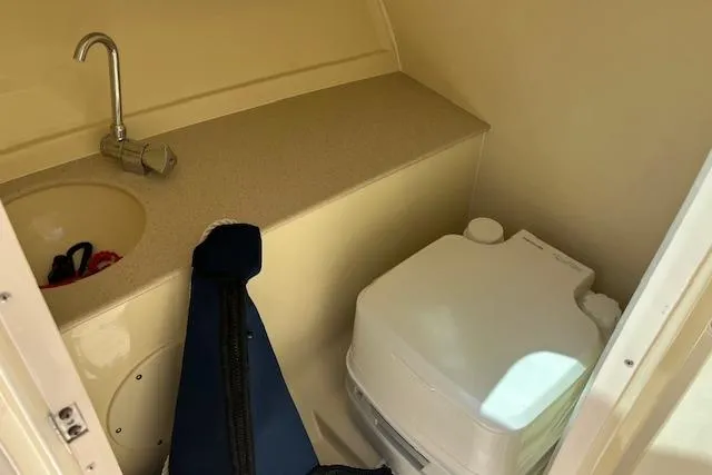 Slide: The Image of 2019 Chris-Craft Launch 27 boat interior with steering wheel and dashboard controls. - 17