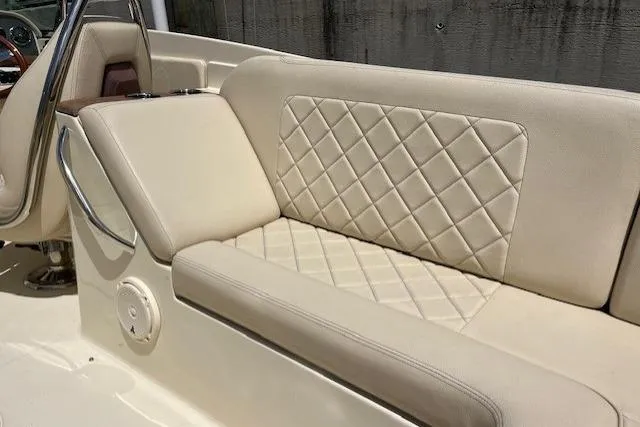 Slide: The Image of 2019 Chris-Craft Launch 27 boat interior with elegant seating and open deck design. - 18