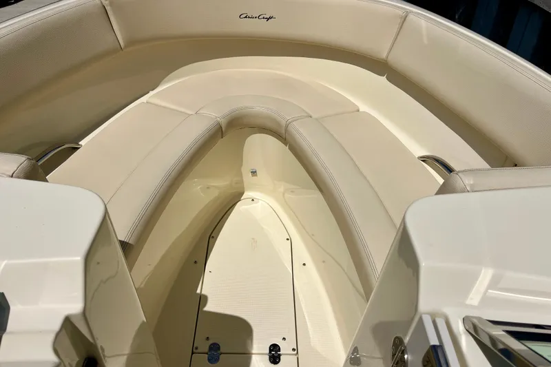 Slide: The Image of 2019 Chris-Craft Launch 27 boat interior with beige seating and elegant design. - 23