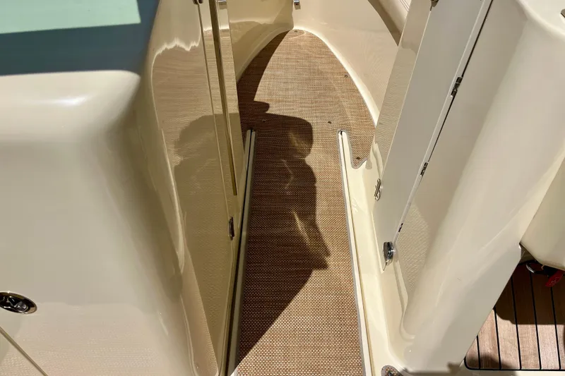 Slide: The Image of 2019 Chris-Craft Launch 27 boat interior with beige flooring and sleek design. - 24