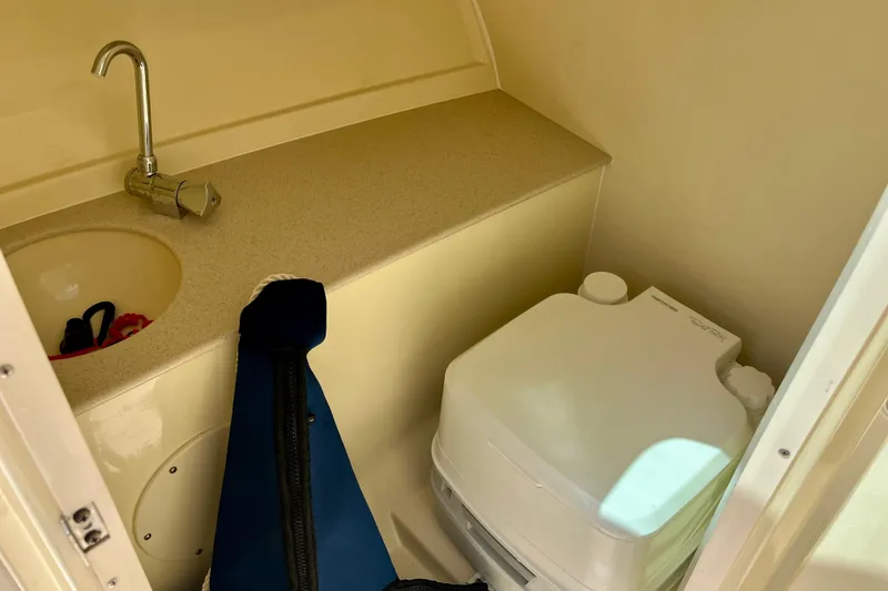 Slide: The Image of 2019 Chris-Craft Launch 27 boat interior with sink and portable toilet. - 28
