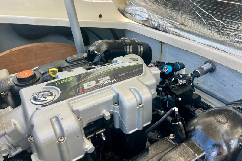 Slide: The Image of 2019 Chris-Craft Launch 27 engine compartment featuring MerCruiser 8.2 MAG engine. - 34