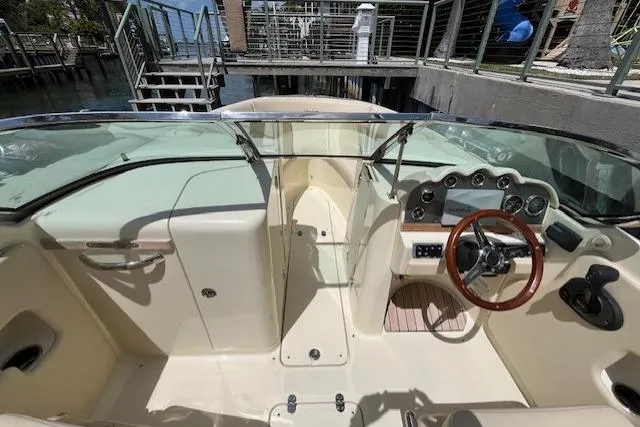 Slide: The Image of 2019 Chris-Craft Launch 27 boat with elegant teak decking and sleek design. - 5