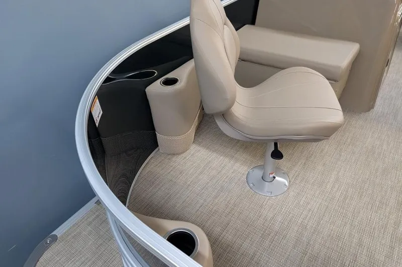 Slide: The Image of 2026 Sylvan Mirage Fish 818 Fish boat interior with beige seating and cup holders. - 4